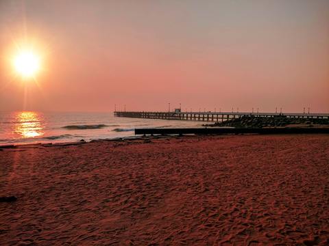 the beach with pier whilst on a walk of Promenade on our Pondy experience